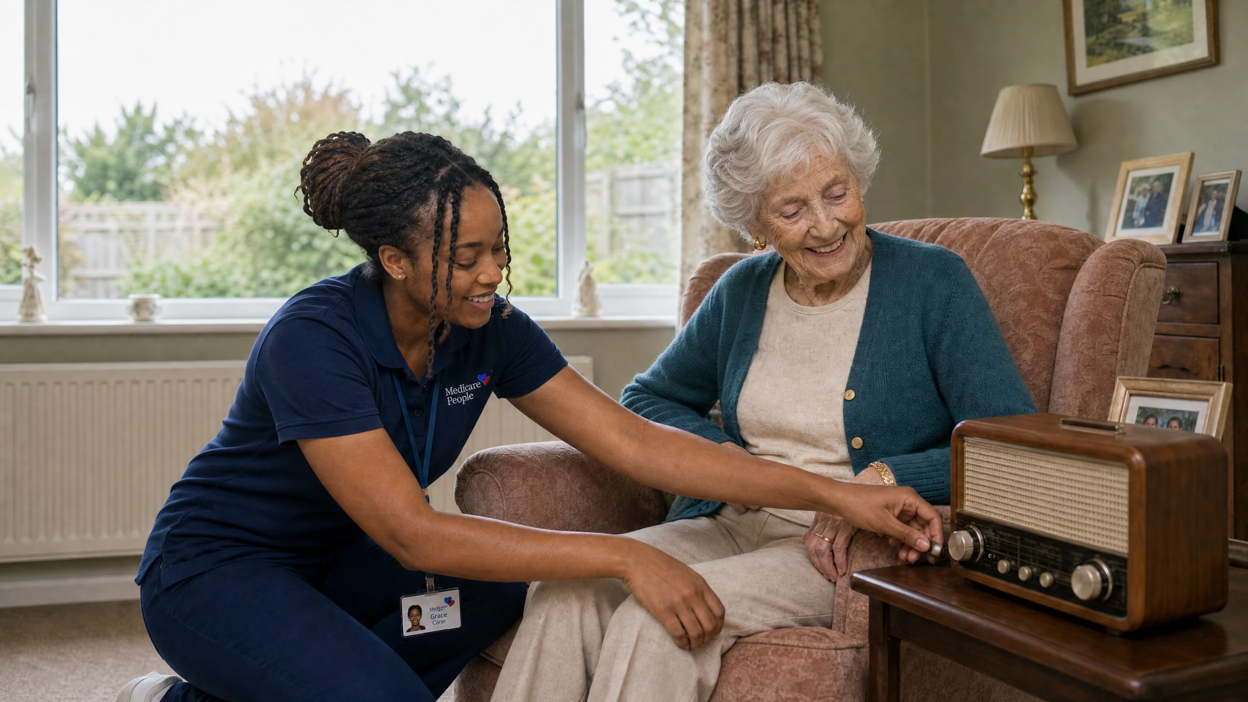 Live-in carer switching on a vintage radio for an older woman in her armchair