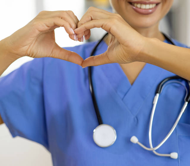 A healthcare professional working on a hospital ward A healthcare professional working on a hospital ward