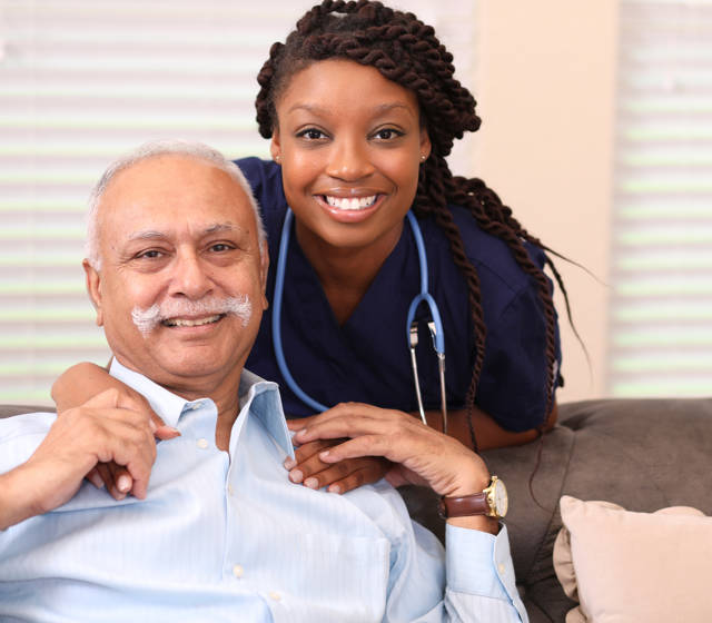 Nurse and man smiling Nurse and man smiling
