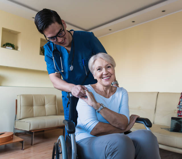 Nurse with patient in wheelchair Nurse with patient in wheelchair