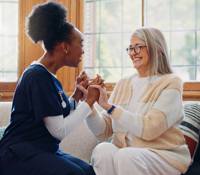 Nurse and woman seated Nurse and woman seated